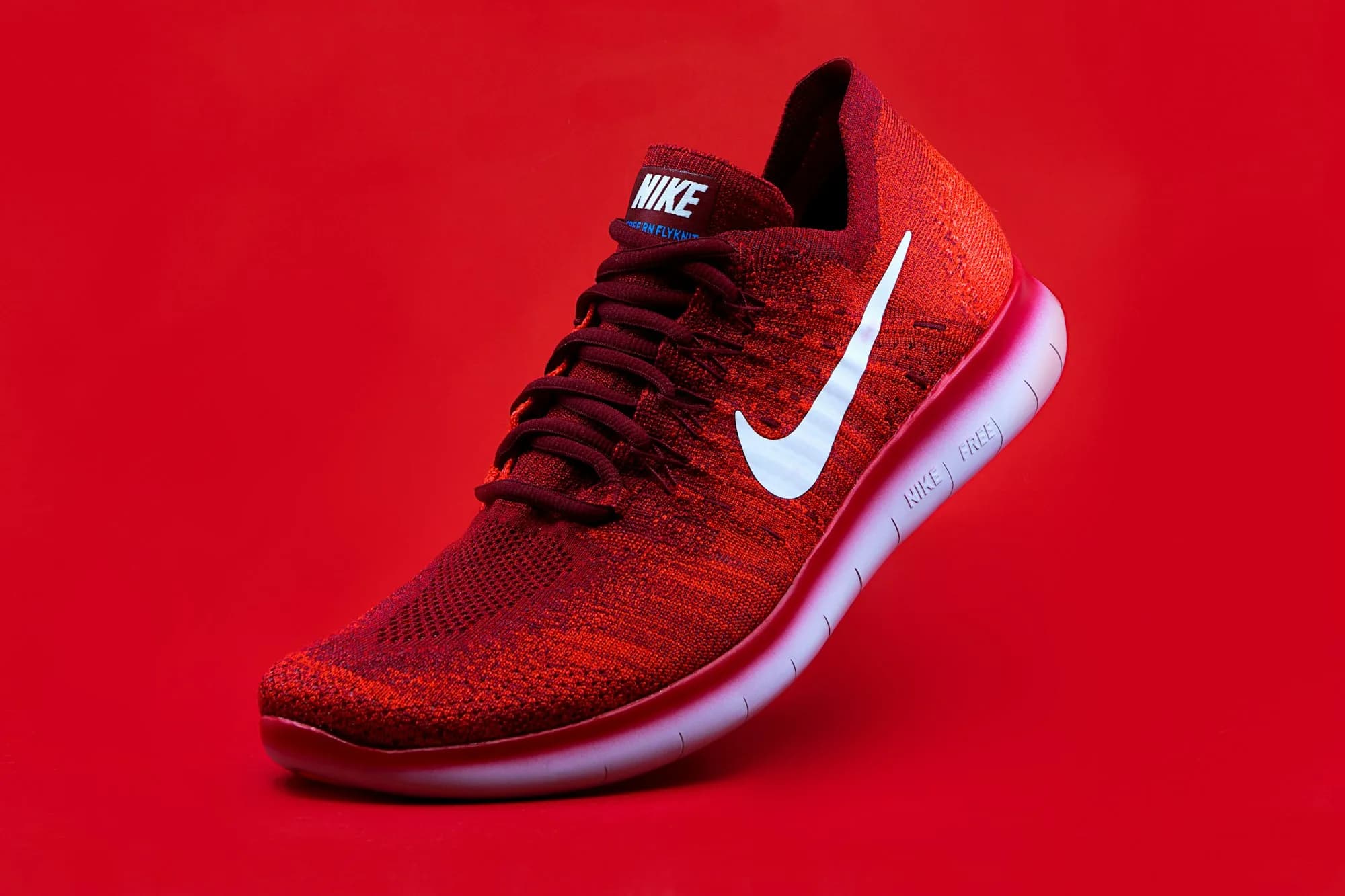 Red running shoe representing sneaker bot checkouts with elite residential proxies